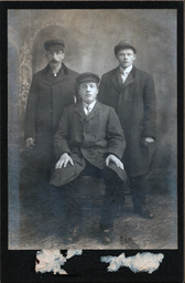 Portrait of Three Men in Coats