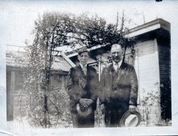 Father and Son in Front of Trellis