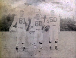 Football ca. 1960: Photos of Players #61, #60, and #50 Standing in Uniform