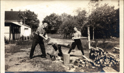 Man and Boy Hewing Wood