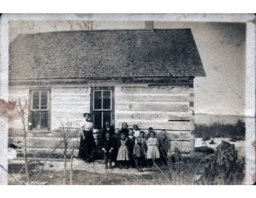 Teacher and Schoolchildren in front of School