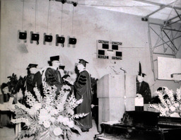 Commencement 1960: Several Men Standing on Stage