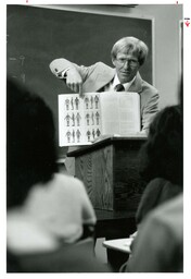 Cameran [Cameron?] Hower Pointing to Textbook (Part of the NMU Historic Photographs Collection)