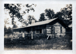 Blurry Photo of Log Cabin