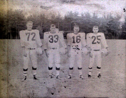 Football ca. 1960: Photo of Players #72, #33, #16, and #25 Standing in Uniform