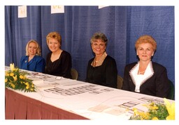 Four Women at Fundraiser Sign-In Table (Part of the NMU Historic Photographs Collection)