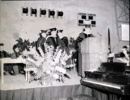 Commencement 1960: View of Stage with Speaker and Three Men