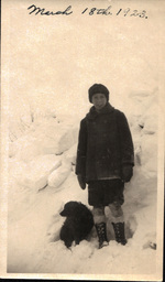 Child and Dog in Snow