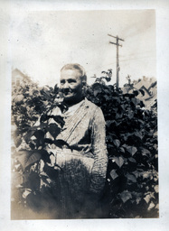 Older Woman Standing in Plants