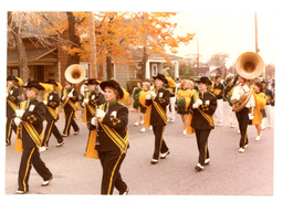 Cheerleaders and Marching Band Performing in Parade (Part of the NMU Historic Photographs Collection)