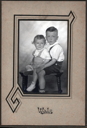 Portrait of Two Children on a Stool