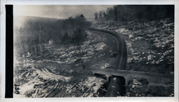 Completed Section of Victoria Dam Wood Stave Pipeline Passing Under Bridge