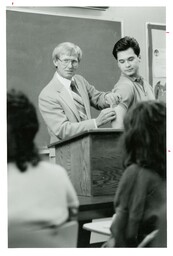 Dean Cameran [Cameron?] Hower Pinching Arm of Student (Part of the NMU Historic Photographs Collection)