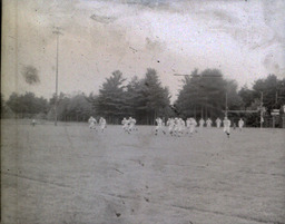 Football ca. 1960: Distance Photo of Players in White Uniforms Playing