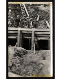 Seven Men Building Wooden Structure