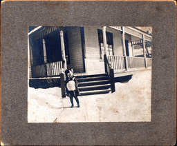 Child on Snowy Sidewalk