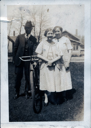 Two Women and a Man with Bicycle