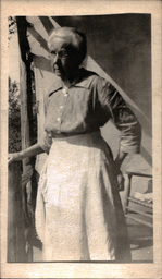 Woman with Apron on Porch