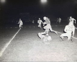 Intrasquad Football Game Spring Practice--Outstanding Back: Mike Strebel, Outstanding Lineman: Wayne Sickler 1961: Player Running With Ball