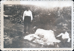 Woman Setting Dishes on Picnic Blanket