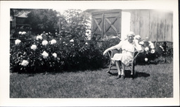 Woman Sitting Outside in Chair