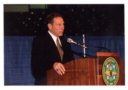 Man Speaking Behind Podium (Part of the NMU Historic Photographs Collection)