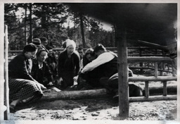 Young People Gathered Around Fire