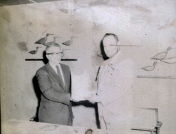 Blue Key Fraternity Installation and Initiation 1961, 1962: Two Men Standing Shaking Hands