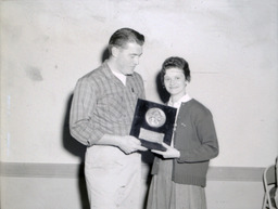 APO Ugly Man Contest--Winner: Stan Albeck, Students: Ray Clemo and Jay Holman 1961: Woman Presenting Plaque to Man