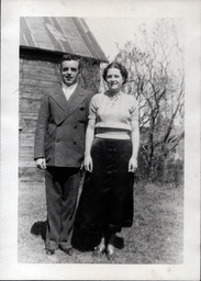 Tom Ross in Suit with Woman