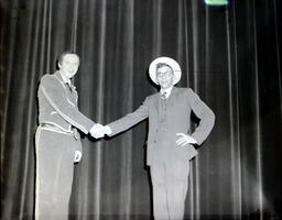 (624-05) Masquers--"Thieves Carnival" 1958: Two Men Shaking Hands on Stage