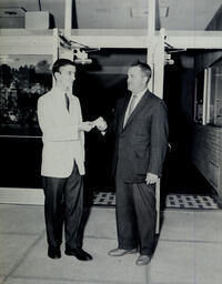 Season Ticket Sales 1960: Usher Hands Patron a Ticket In Front of Theater