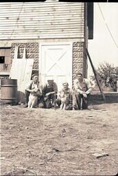 (037-001) Men and Dogs in Front of Henery Brothers' Barn