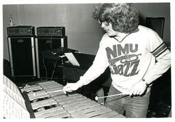 Student in NMU Jazz Sweatshirt Playing Xylophone (Part of the NMU Historic Photographs Collection)