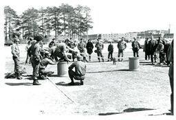 ROTC Students Making Bridge Out of Wood and Trash Cans (Part of the NMU Historic Photographs Collection)