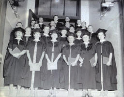 Master's Degree Recipients Summer 1960: Students Standing With Diplomas on Stairs (Blurry)