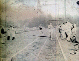 Track--(?)Michigan May 5, 1960: Two Runners on Track and Spectators