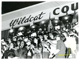 Pep Band Playing in front of Wildcat Country Sign (Part of the NMU Historic Photographs Collection)