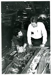 Students Leaning over Open Hood of Car (Part of the NMU Historic Photographs Collection)