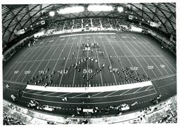 Aerial View of Marching Band in Diamond Formation in Superior Dome (Part of the NMU Historic Photographs Collection)