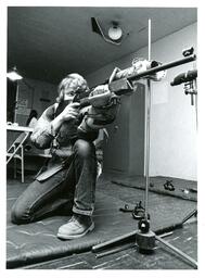 Student Firing Large Gun in Shooting Range (Part of the NMU Historic Photographs Collection)