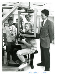 Child Uses Exercise Equipment while Group Watches (Part of the NMU Historic Photographs Collection)