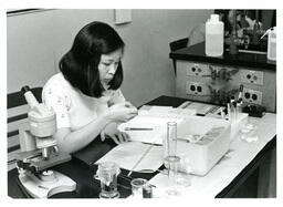 Student Working on Experiment in Physics Lab (Part of the NMU Historic Photographs Collection)