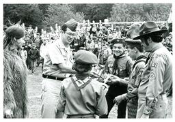 Man in Military Uniform Giving Awards to Boy Scouts at Outdoor Ceremony (Part of the NMU Historic Photographs Collection)