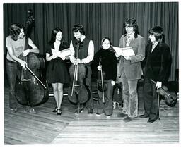 Chamber Music Group Posing with Instruments and Sheet Music (Part of the NMU Historic Photographs Collection)