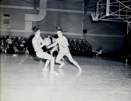 (128-07) Basketball NMC vs. Michigan Tech Feb. 24, 1960: Northern Player Pulling to Shoot