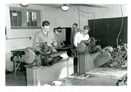 Students and Professor Working with Machinery (Part of the NMU Historic Photographs Collection)