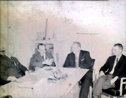 NMC - MSU Basketball Coaches and Officials February 4, 1961: Four Men Sitting Around Table