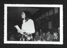 Girl Holding Paper at Banquet (2 of 2)