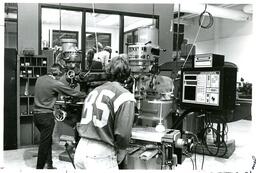 Four Students Working in a Machine Shop (Part of the NMU Historic Photographs Collection)